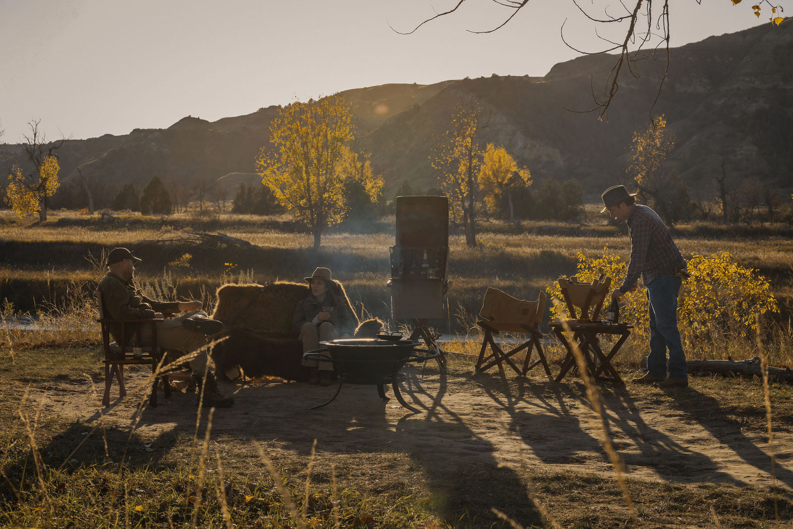 People having a field picnic
