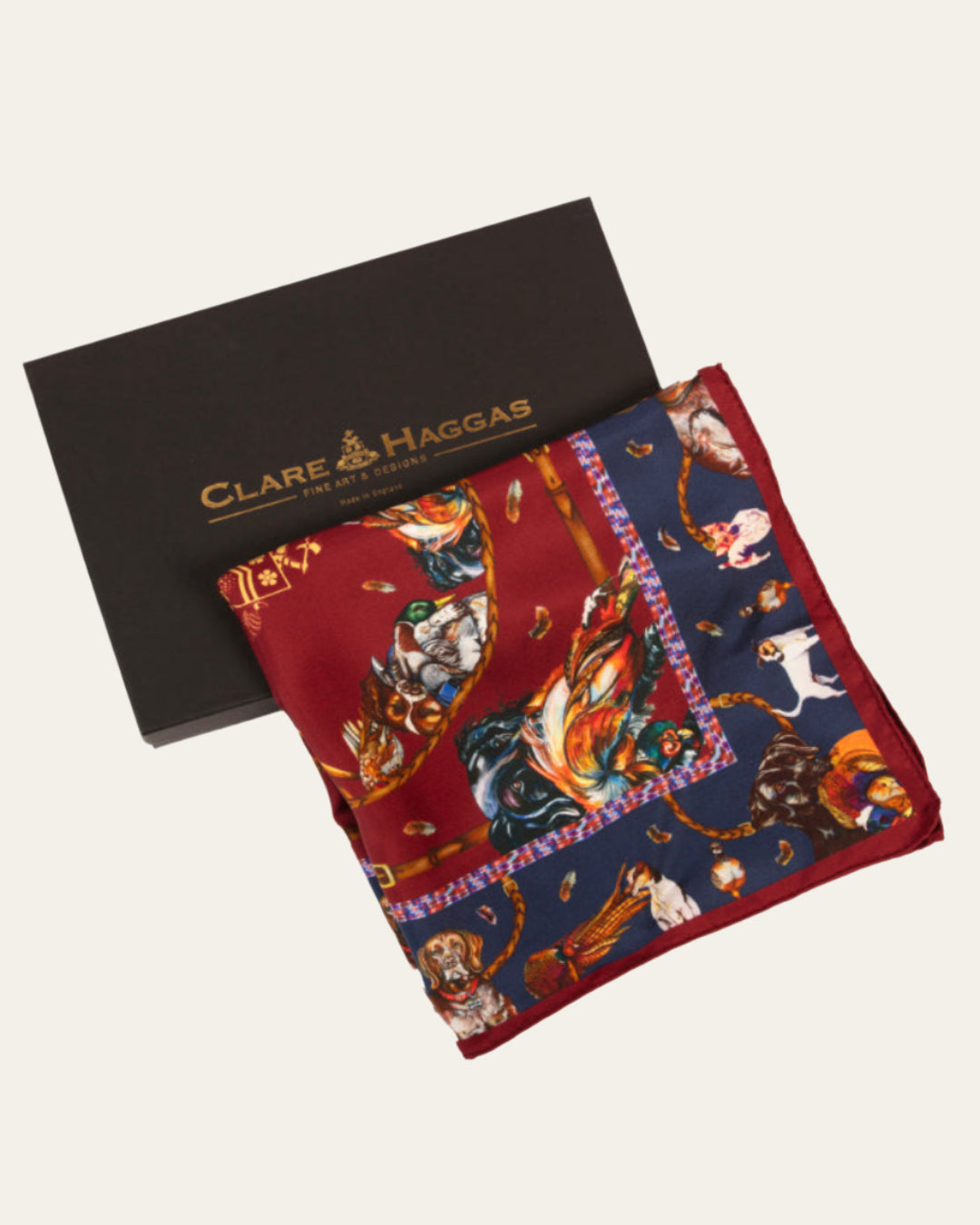 Elegant claret red silk scarf with navy border, showcasing gun dogs and game birds by Clare Haggas