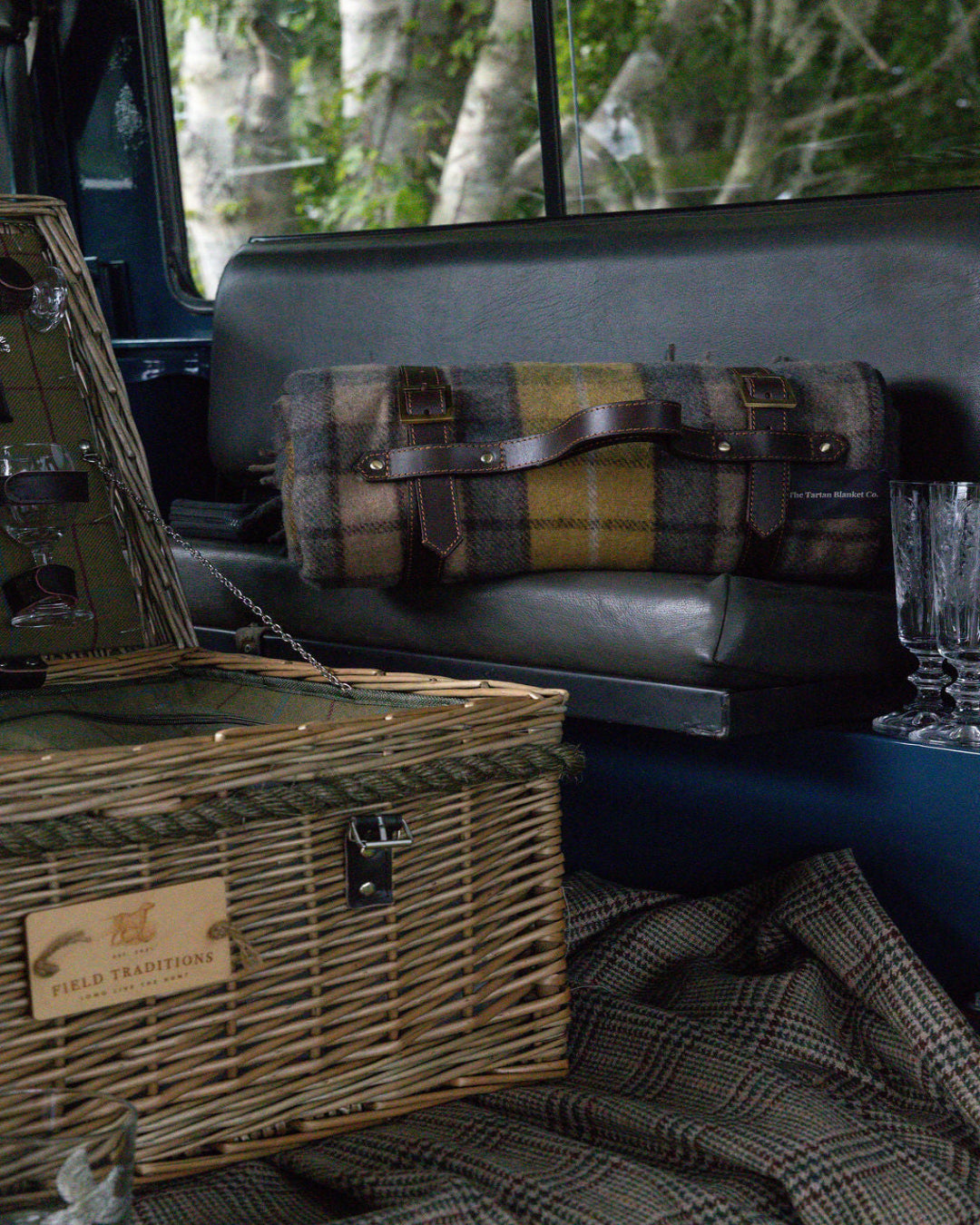 Buchanan Natural Tartan recycled wool picnic blanket with leather carrier
