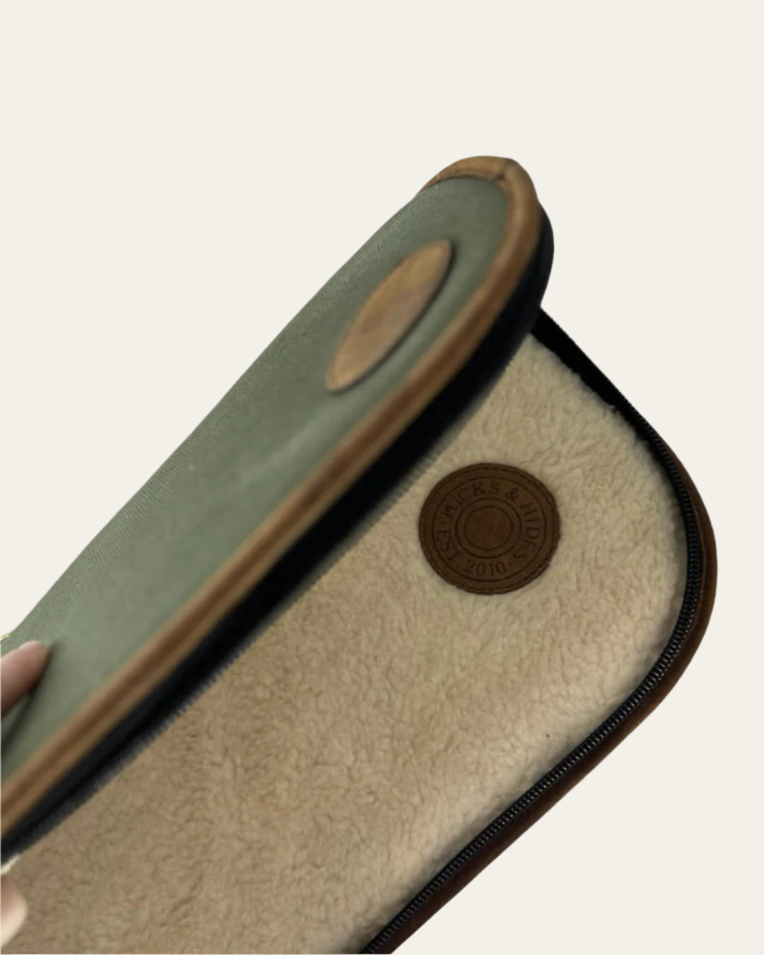 Durable canvas shotgun slip with leather accents and brass fittings for secure storage