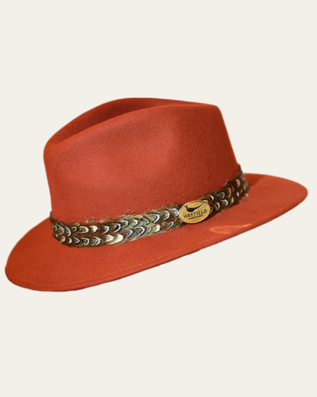 Classic fedora hat with game bird feather wrap in rust orange