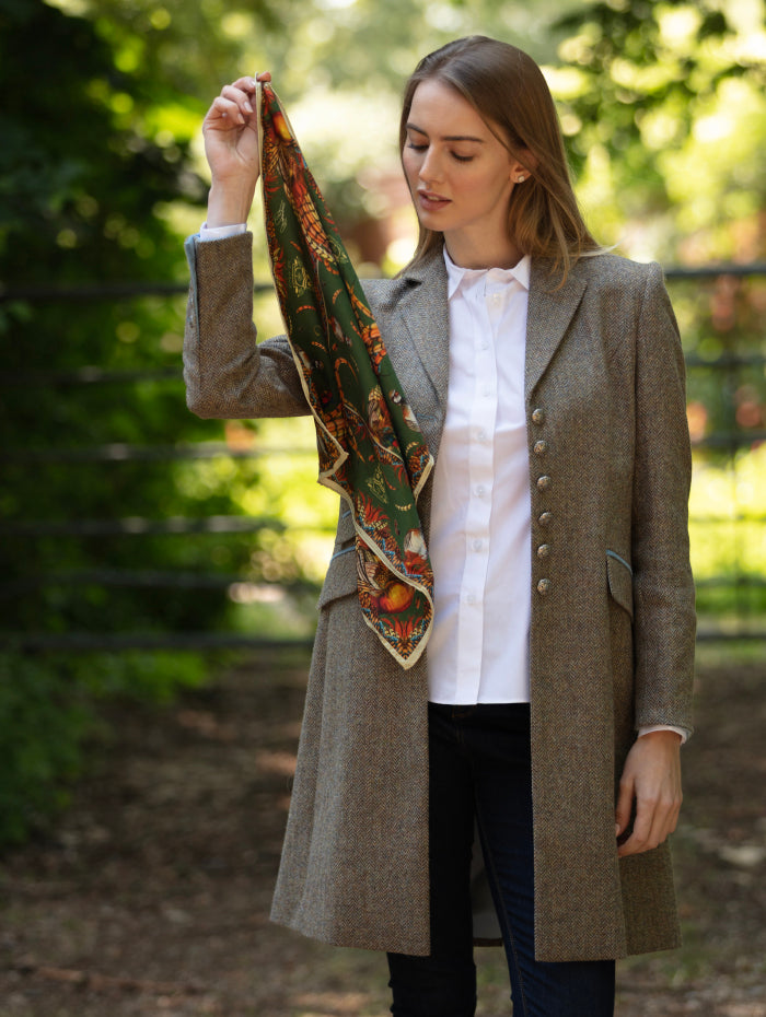 Luxury silk scarf by Clare Haggas with colourful game birds, perfect for elegant styling