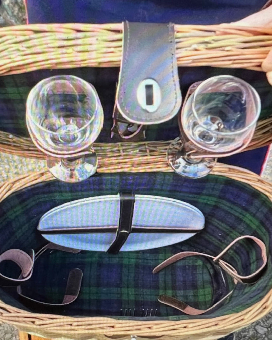 Elegant over-the-shoulder blue tweed picnic hamper with stainless steel cutlery and wine glasses