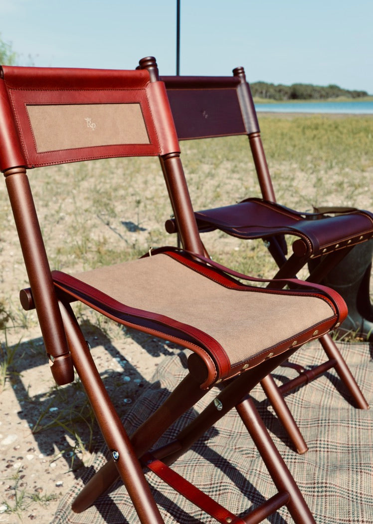 Cotswolds foldable field chair with green canvas and honey cowhide leather, backrest included