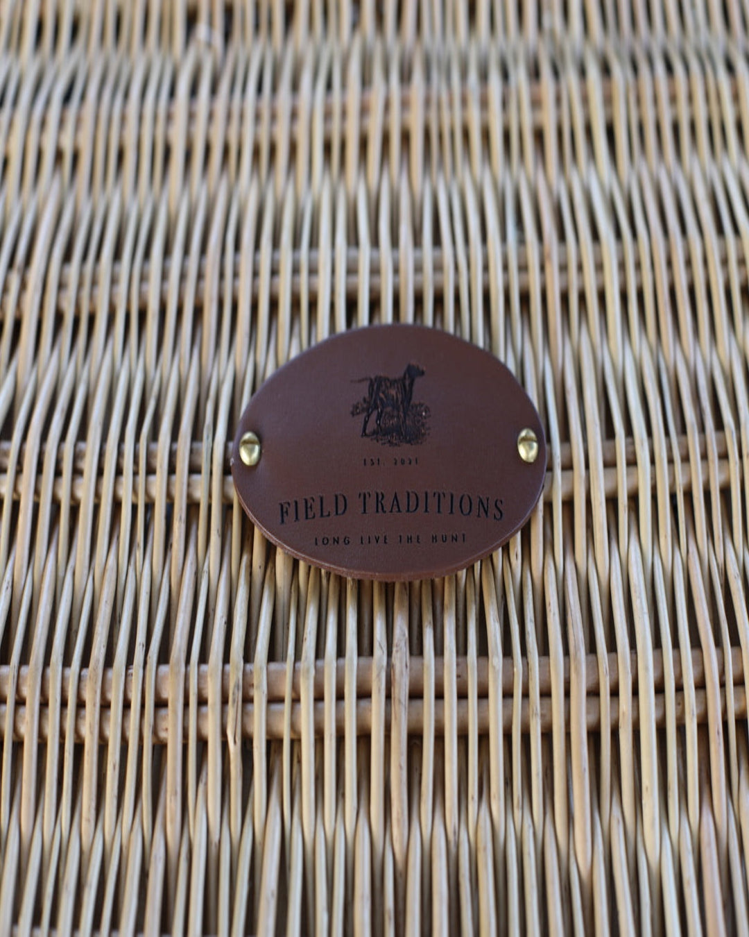 Classic British-style picnic hamper with plaid lining and secure storage for picnic essentials