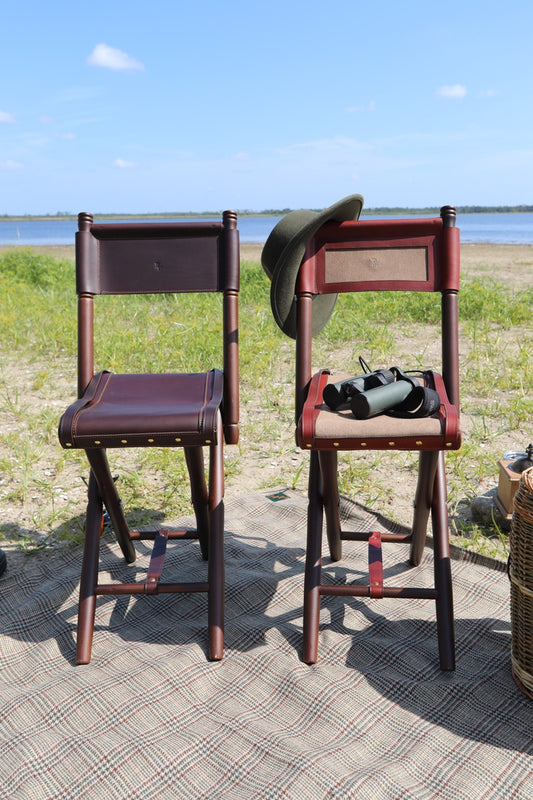 Foldable leather seat with backrest and beech wood legs for outdoor use