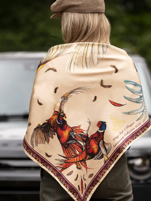 Luxury silk scarf by Clare Haggas, featuring vibrant mulberry and champagne tones with intricate bird design