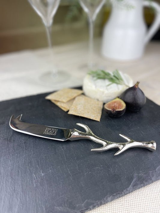 Stainless steel antler cheese knife with curved handle, ideal for slicing and serving cheese